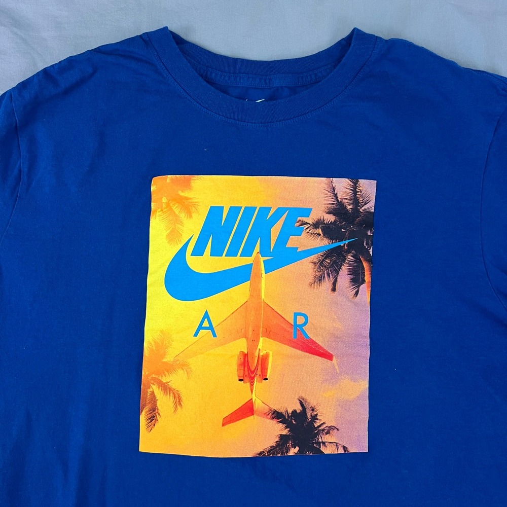 NIKE Men's T Shirt Size XL Blue Graphic Airplane Palm Tree Tropical The Nike Tee